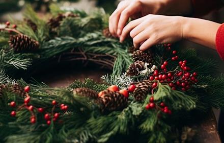 Someone making a Christmas Wreath