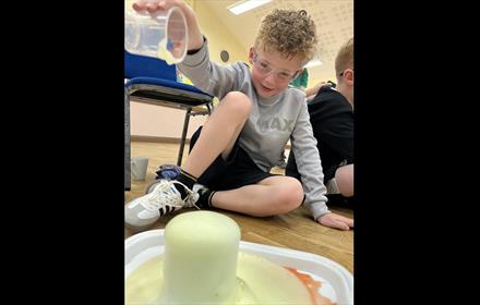 Child performing a science experiment