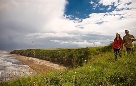 couple walking on the Durham Heritage Coast