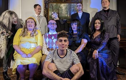 Actors dressed a Addams Family characters