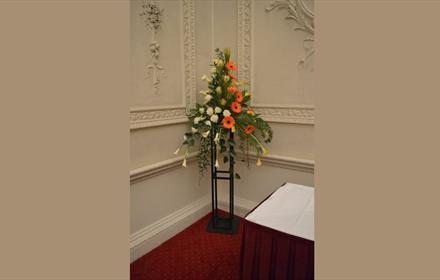 Flower arrangement with white and orange flowers