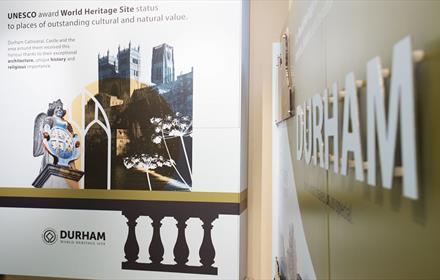 Image of an information board showing Durham Cathedral and text describing the World Heritage Site at Palace Green Library.