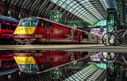 Two trains parked up in a station