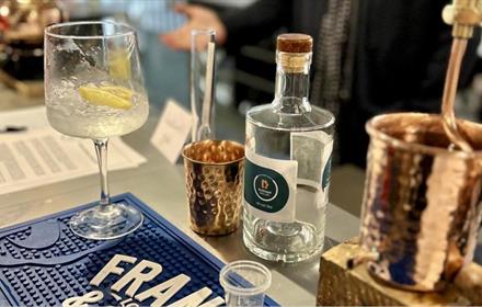 Image of gin and gin classes on the bar.