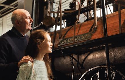 Grandad and Granddaughter looking at Locomotion