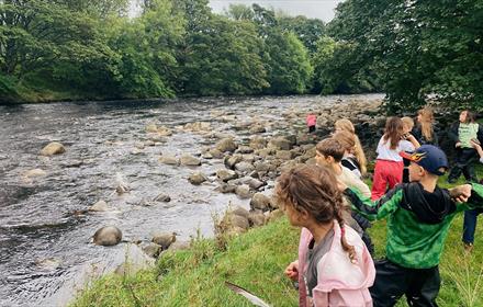 Children by a river