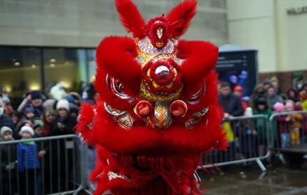 People stood watching the traditional lion dance at Millennium Place Durham, part of the Lunar New Tear celebrations.