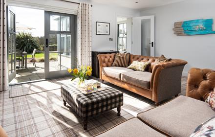 Light and airy lounge with French windows opening onto the garden.