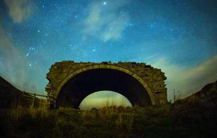 An arch at night