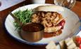 Close up shot of a pulled port sandwich served at Vennels Cafe.