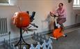 Man on an exercise bike as part of interactive sculpture -  'Humanimals' exhibition at Ushaw