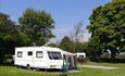 Pitched caravan at Doe Park Caravan Site