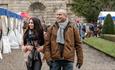 Two people looking at stalls at Bowes Winter Market