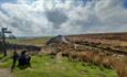 Countryside around Blanchland with women using App.