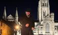 Andrew Ross (Tour guide) standing in front of Durham Cathedral on an evening