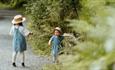 Two children walking the trail