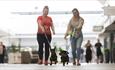 Two women walking their dogs at Dalton Park