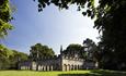 Auckland Deer Park and Deer House, lawn and trees to foreground.