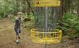A child playing Disc Golf - Forestry England