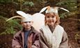 2 children wearing Easter Bunny ears.