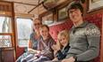 A family on a train at Weardale Railway.