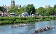Teams of eight racing at Durham Regatta on a beautiful sunny day against the backdrop of Durham Cathedral and Castle.