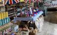 Farm Shop display of local produce such as drinks, colourful candles and gifts.
