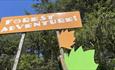 Orange Forest Adventure sign at Broom House Forest Adventure.