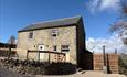 Front of barn with hot tub