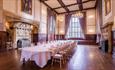 The Great Hall with large dining table set for dining.