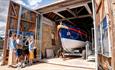 family admiring the lifeboat at East Durham Heritage & Lifeboat Centre, Seaham Harbour.