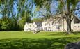 Exterior of Hall Garth Hotel, white building, lawns and trees