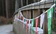 Hamsterley Christmas bridge with bunting.
Credit: Forestry England/Crown Copyright