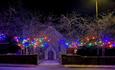 Holy Trinity Church, WIngate, lit up with fairy lights at night.