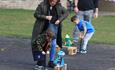 Children and parents playing with handcrafted rockets.