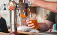 Image of someone working at the bar and pouring drinks at the Chester-le-EATS event.