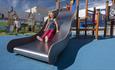 A child playing on a slide at Dalton park