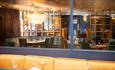 Mirrored wall reflecting the dining area