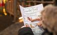 Image of someone looking at a leaflet for the Enchanted Forest Trail