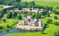 An overhead drone shot of the castle and grounds