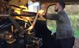 Someone taking control of a historic Steam locomotive.