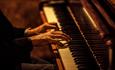 Close-up of someone playing the piano.