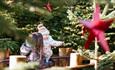 Image of a mother and child enjoying the enchanted trail at the Plotters' Forest