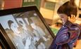 A child enjoying an exhibition at The Story, Mount Oswald.