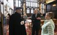 Member of the Mayoral Bodyguard talking to visitors in the Guildhall, Durham Town Hall