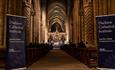 Speakers from Durham Cathedral Institute debate to an audience in the nave.