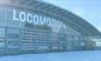 The front of Locomotion Museum covered in snow.