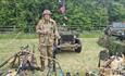 VE Celebrations re-enactors - man in army uniform, surrounded by army vehicles and artillery
