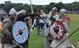 People enjoying displays of Viking combat at Durham Regatta