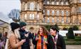 Four friends enjoying festive drinks at The Bowes Museum Winter Market. ©TheBowesMuseum